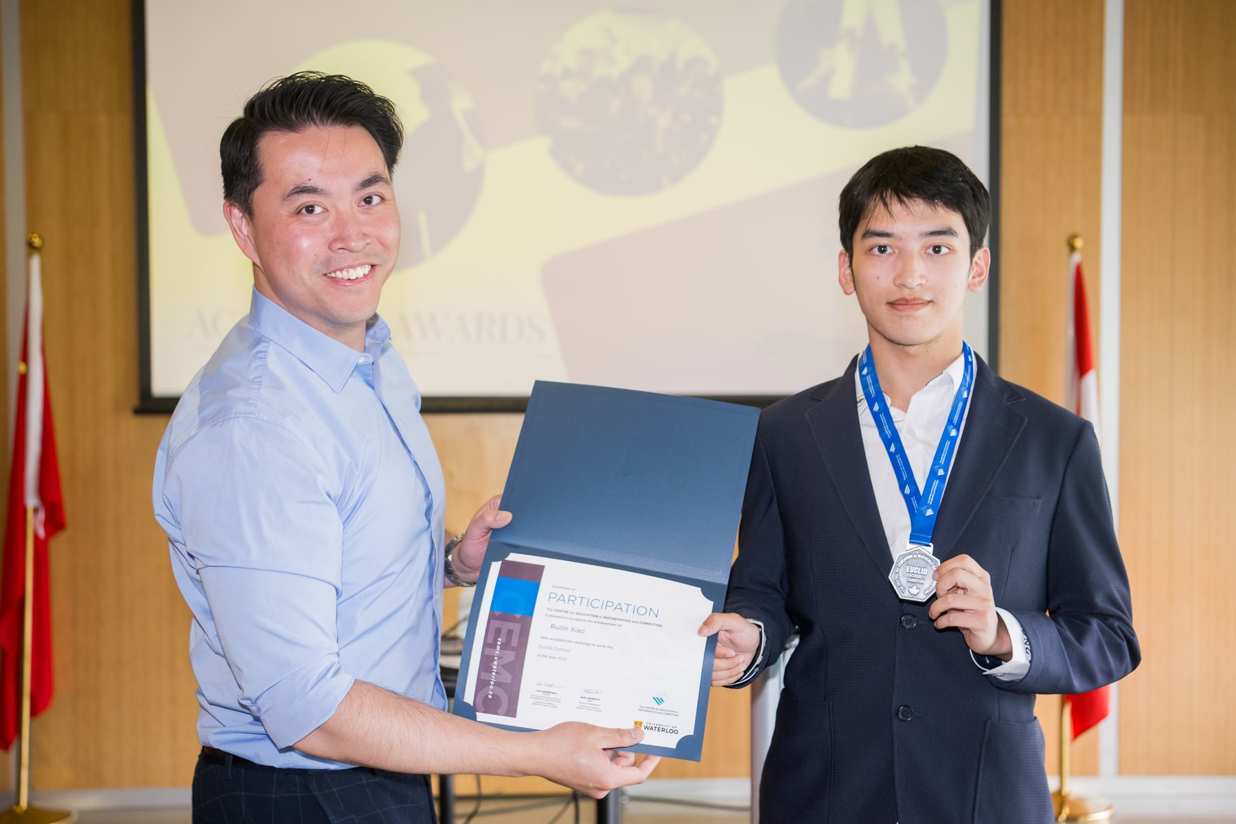 A student receiving recognition at a 2025 graduation event